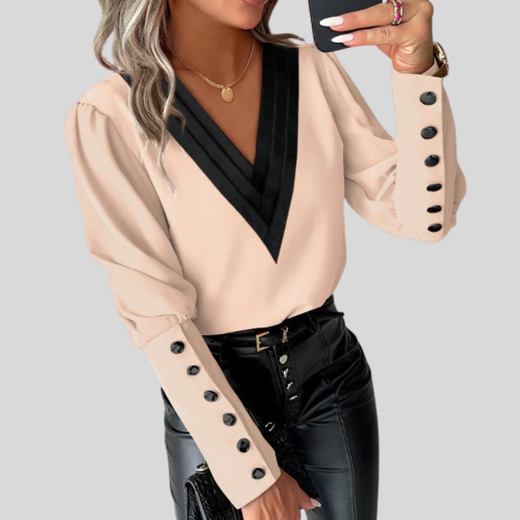 Blouse met knoopjes aan de voorkant en lange mouwen voor dames – opvallende mouwen met casual elegantie