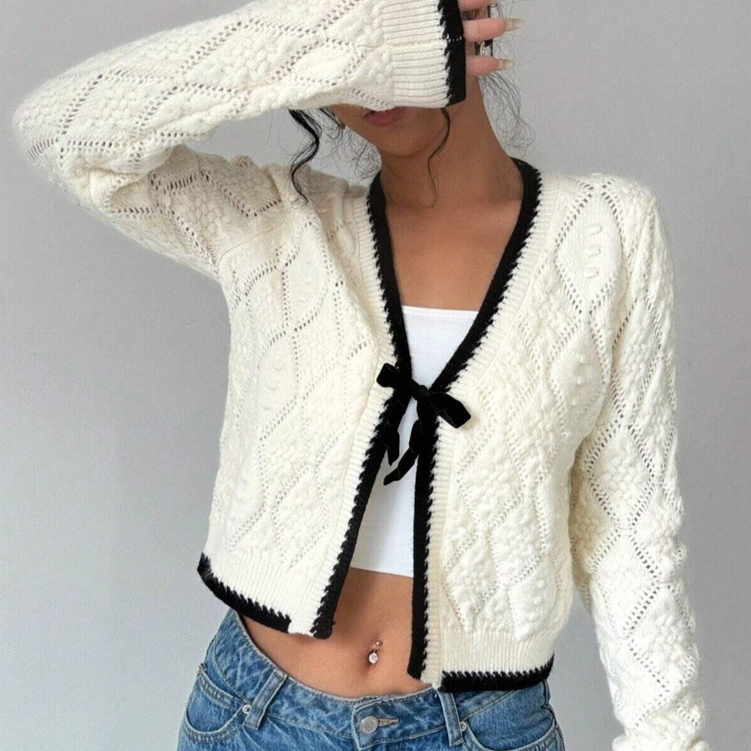 Chique vest met zwarte bies