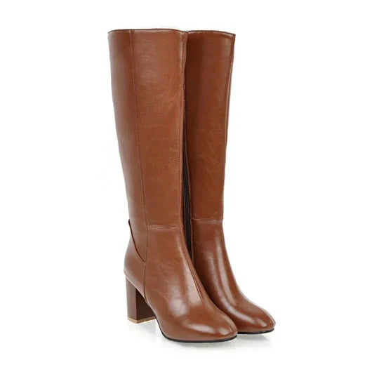 Dameslaarzen met hak en rits, kniehoog. Elegant design gecombineerd met dagelijks comfort.