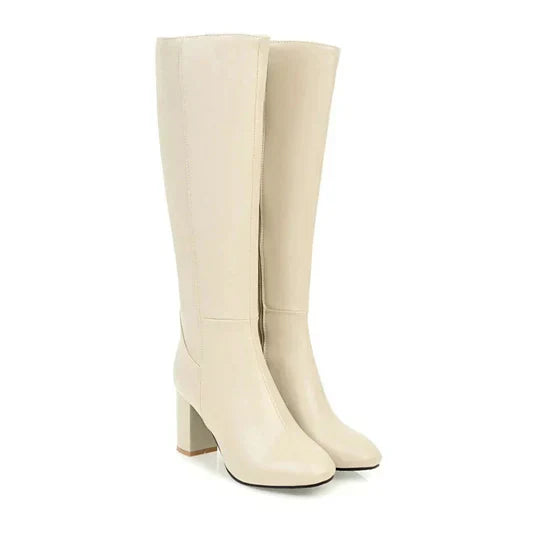 Dameslaarzen met hak en rits, kniehoog. Elegant design gecombineerd met dagelijks comfort.