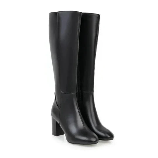 Dameslaarzen met hak en rits, kniehoog. Elegant design gecombineerd met dagelijks comfort.