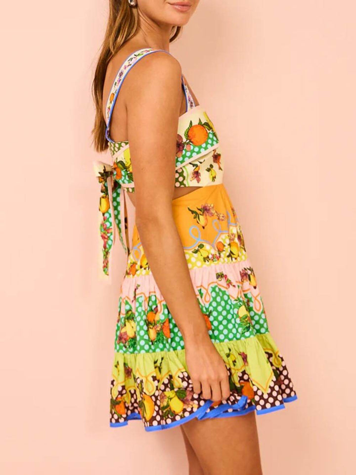 Korte jurk met fruitprint en speelse stroken