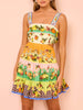Korte jurk met fruitprint en speelse stroken