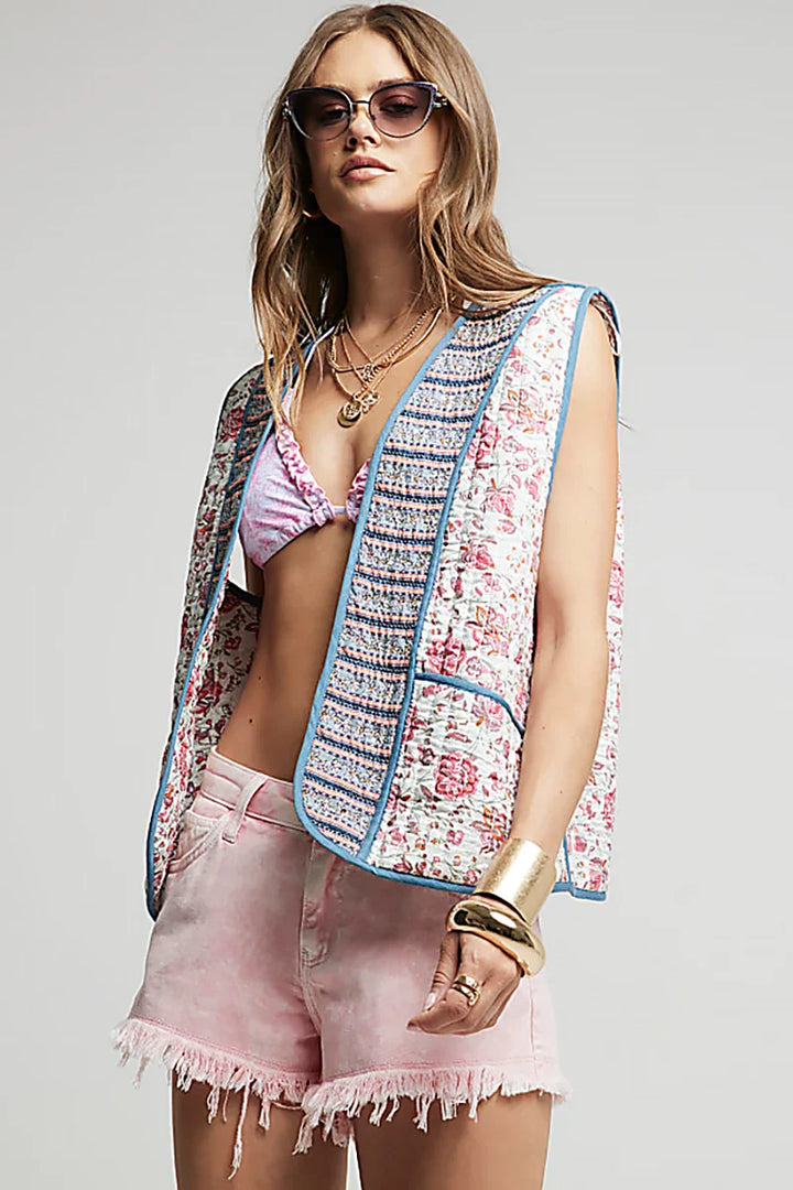 Mouwloos bloemenvest met geborduurde biezen